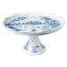 White ceramic cake stand with blue decorative patterns on a white background