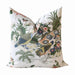 Decorative pillow with bird and floral pattern on a white background