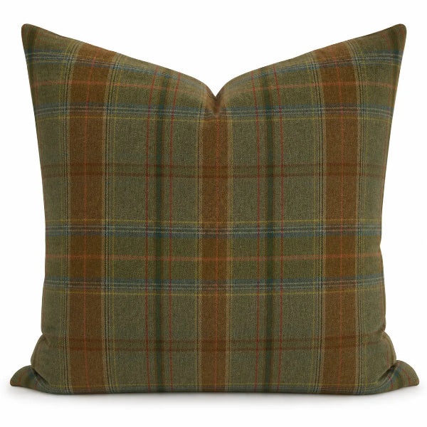 A square throw pillow featuring a classic plaid pattern in olive green, rust brown, and thin blue and red stripes, set against a plain white background.
