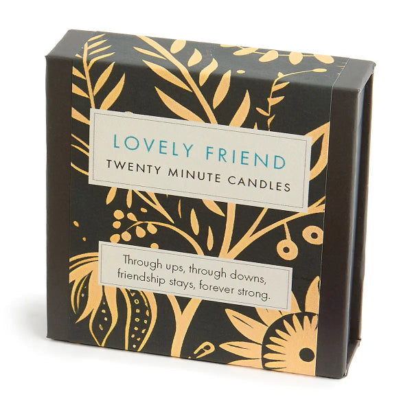 Box of 'Lovely Friend' candles with decorative design and text.