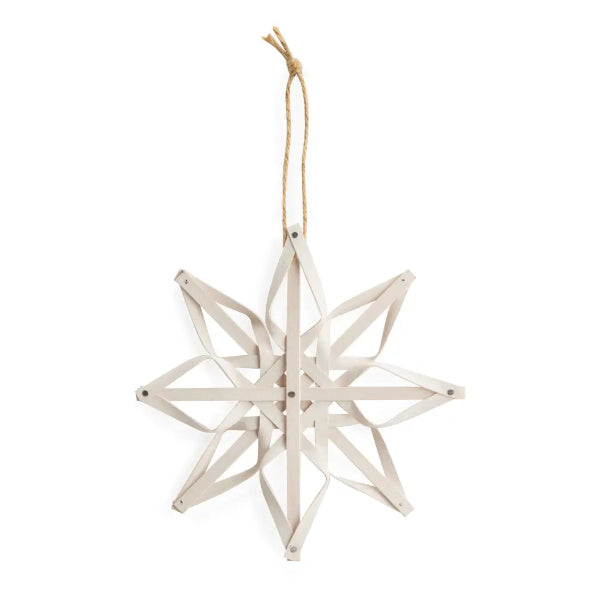 White geometric star-shaped ornament on a white background