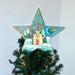 Star-shaped Christmas tree topper with a snowy scene and 'Let it Snow' text on a Christmas tree.