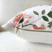 Floral-patterned pillow with a zipper on a white background