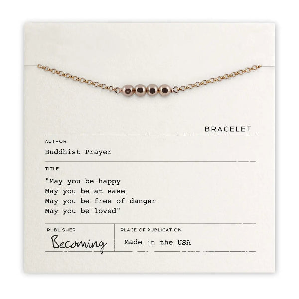 Bracelet on a card with text and branding details