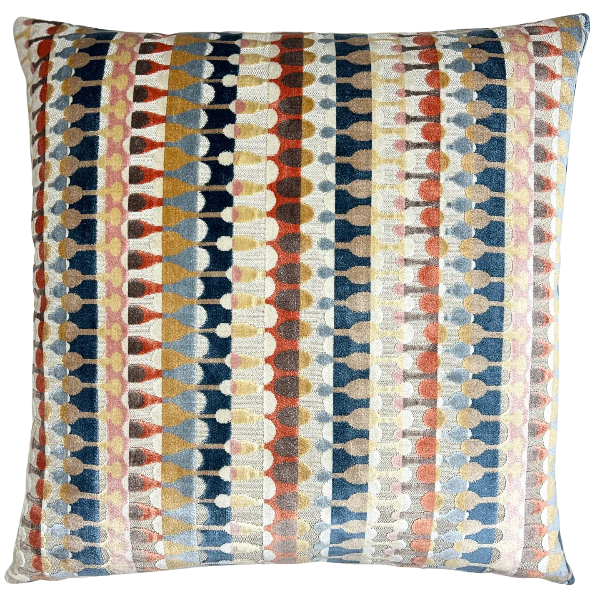 A square throw pillow featuring a vertical striped geometric pattern in navy blue, rust orange, mustard yellow, beige, and white.