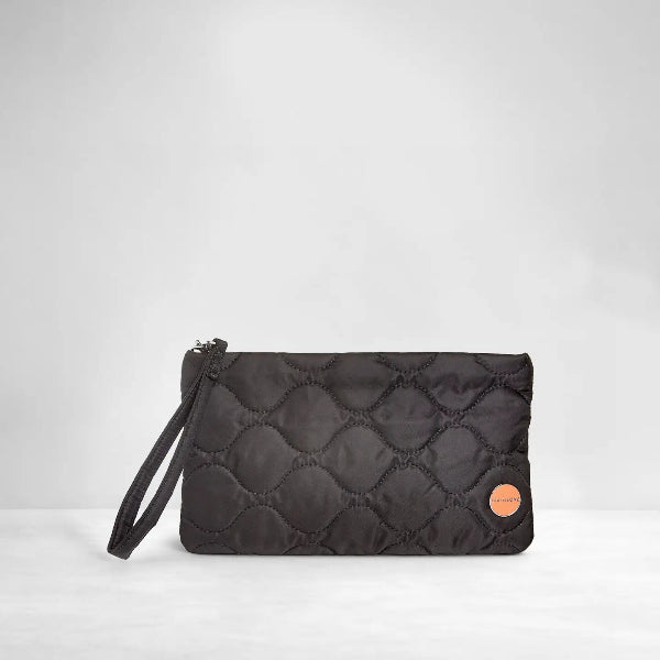 A black quilted nylon wristlet clutch with a matching wrist strap and a small circular orange logo patch, set against a light gray studio background.