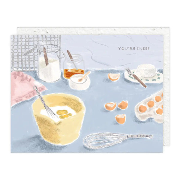 Illustration of baking ingredients and utensils with 'You're Sweet' text on a blue background