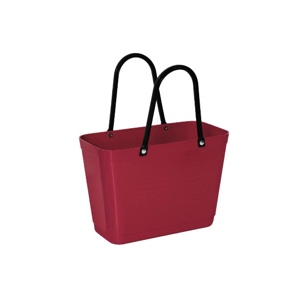 A red plastic shopping tote bag with black double shoulder straps, shown on a plain white background.