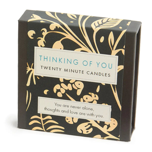 Box of 'Thinking of You' candles with decorative design and text.