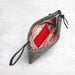 Gray pouch with red interior on a white background