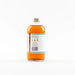 Bottle of syrup with a label on a white background