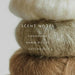 Stack of brown yarn with scented notes text overlay on a light background