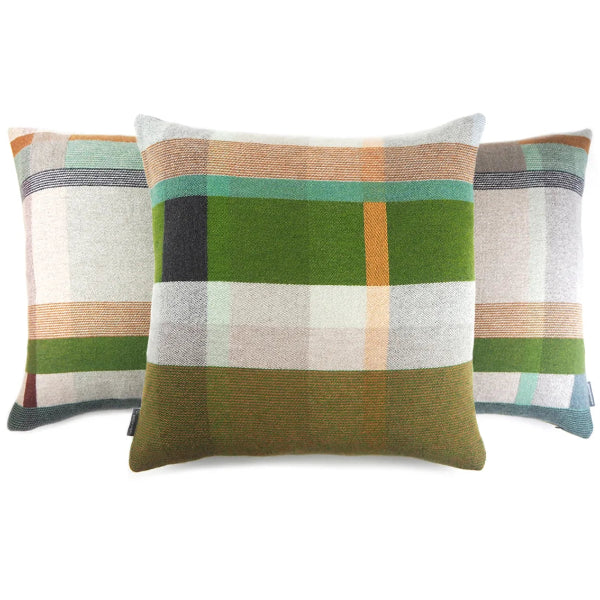 Three square throw pillows with a woven plaid pattern in shades of green, beige, orange, and gray, arranged against a plain white background.
