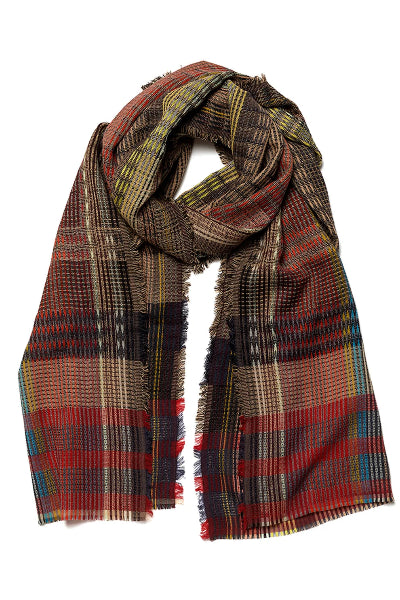 A multicolor plaid scarf with fringed edges, featuring a mix of brown, red, blue, yellow, and black stripes, displayed on a solid white background.