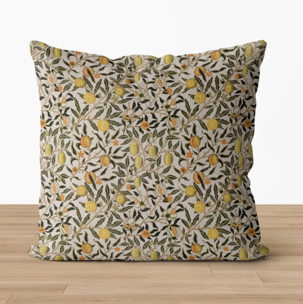 Decorative pillow with floral pattern on a wooden floor