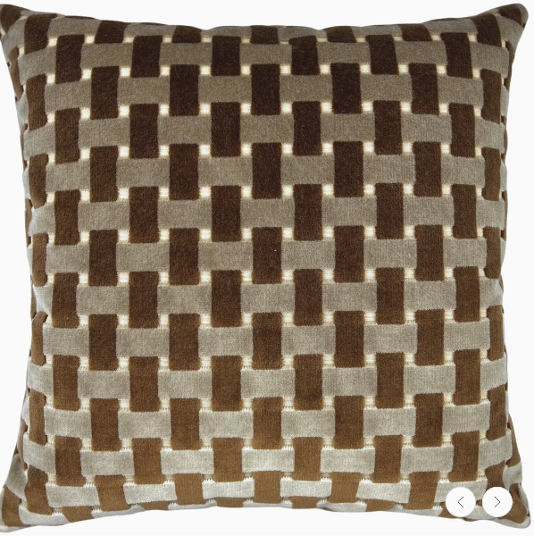Decorative pillow with a brown and beige woven pattern on a white background