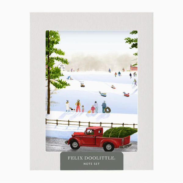 Note set with a winter scene illustration featuring a red truck and people by a lake, branded 'Felix Doolittle'.