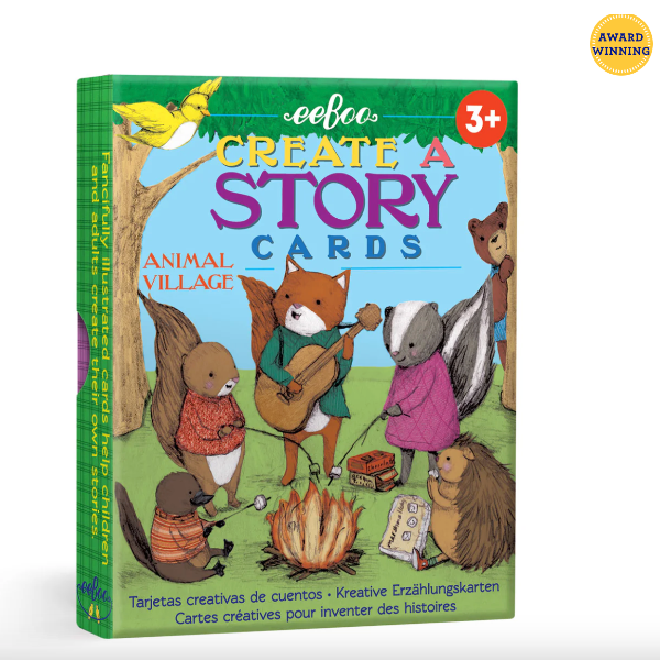 Book titled 'Create a Story Cards: Animal Village' by eeBoo with colorful illustrations of animals around a campfire.