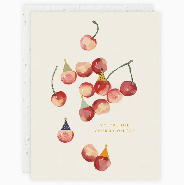 Card with cherries wearing party hats and text 'You're the cherry on top' on a white background
