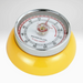 Yellow kitchen timer with a silver dial on a white background