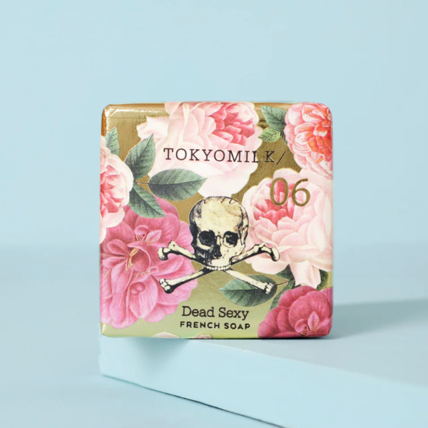 TOKYOMILK Dead Sexy French Soap packaging with floral design and skull illustration on a light blue background
