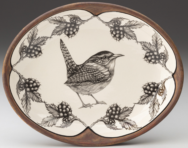 Decorative plate with a bird and berry design on a white background