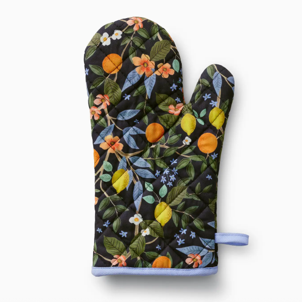 Oven mitt with floral and fruit pattern on a white background