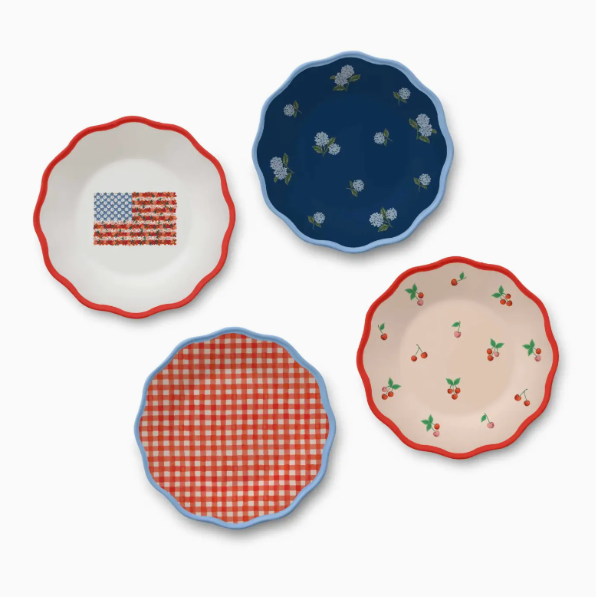 Four decorative plates with different patterns on a white background