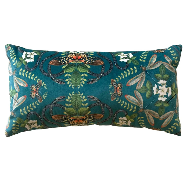 A rectangular lumbar throw pillow featuring a detailed botanical and insect pattern in teal, green, brown, and white on a solid white background.