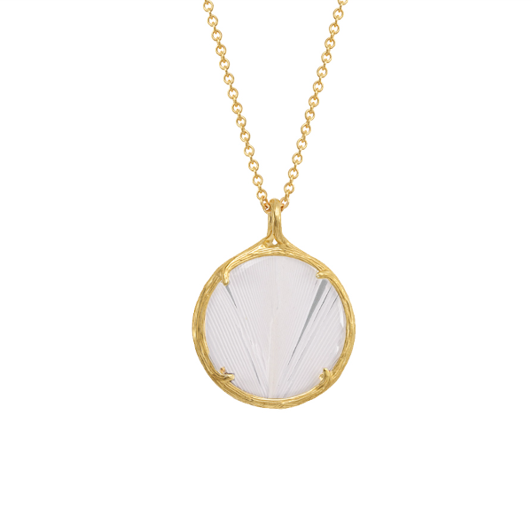 A gold pendant necklace featuring a circular frame with a textured, fan-like white inlay, suspended from a delicate gold chain against a solid white background.