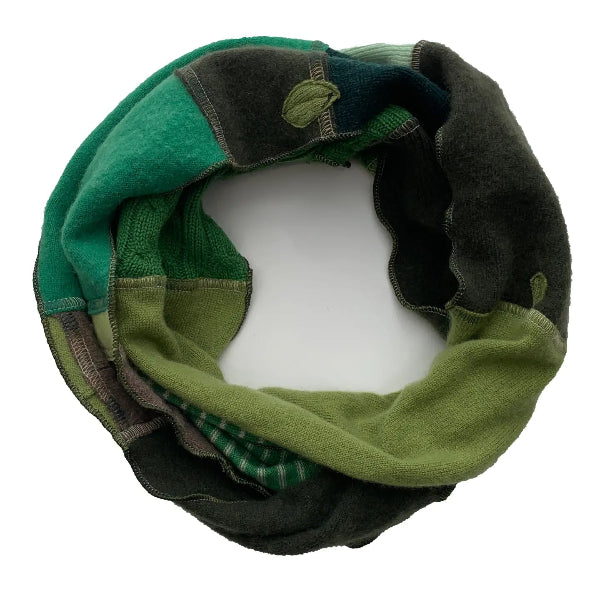 Green and black patterned infinity scarf on a white background