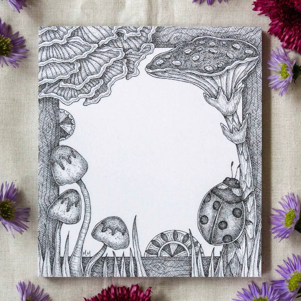Black and white illustration of mushrooms and a ladybug on a textured surface with purple flowers.