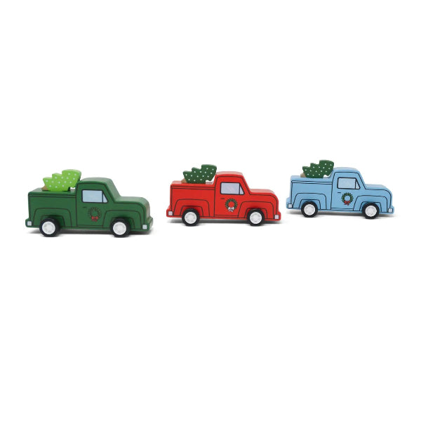 Three toy trucks in green, red, and blue with Christmas trees on a white background