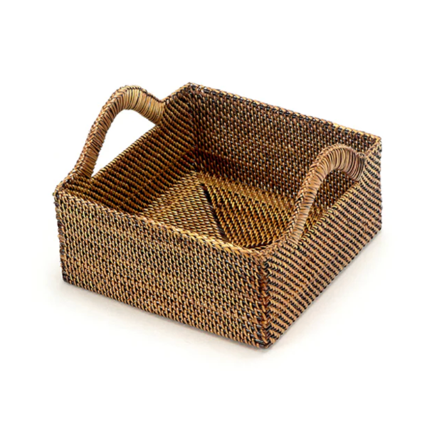 Woven basket with handles on a white background
