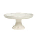 White ceramic cake stand on a white background
