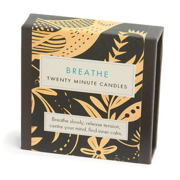 Box of 'Breathe' twenty-minute candles with gold leaf design on a white background