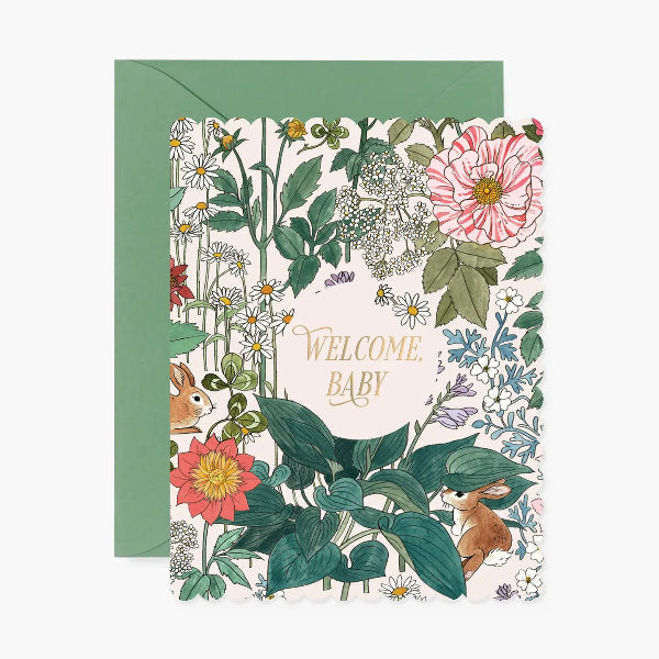 Greeting card with floral design and 'Welcome Baby' text, featuring a green envelope.