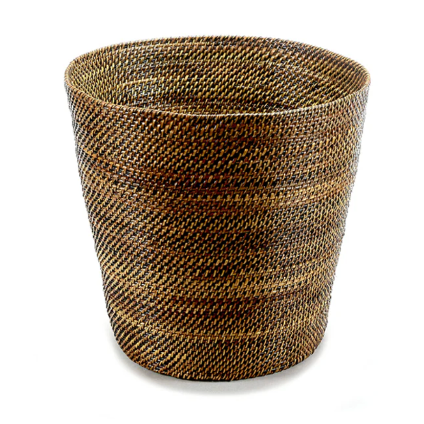 Woven brown basket on a white background