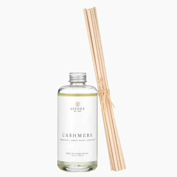 Linnea Cashmere diffuser bottle with reeds on a white background