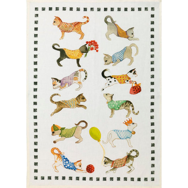 Tea towel with illustrations of cats in colorful outfits on a white background