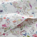 Floral patterned fabric with colorful flowers on a white background