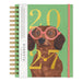 A spiral-bound 2027 dachshund planner by Seedings, featuring a brown dachshund wearing pink glasses and gold-framed glasses on a mint green cover with gold foil numbers.