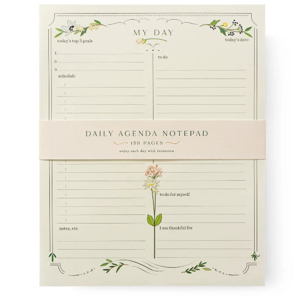 Daily agenda notepad with floral design on a white background