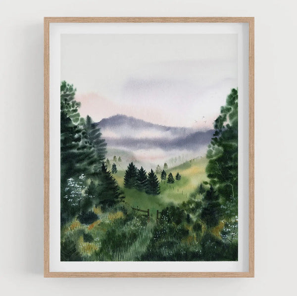 Framed painting of a mountain landscape with trees and a fence.