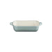 Rectangular baking dish with a light blue exterior and cream interior on a white background