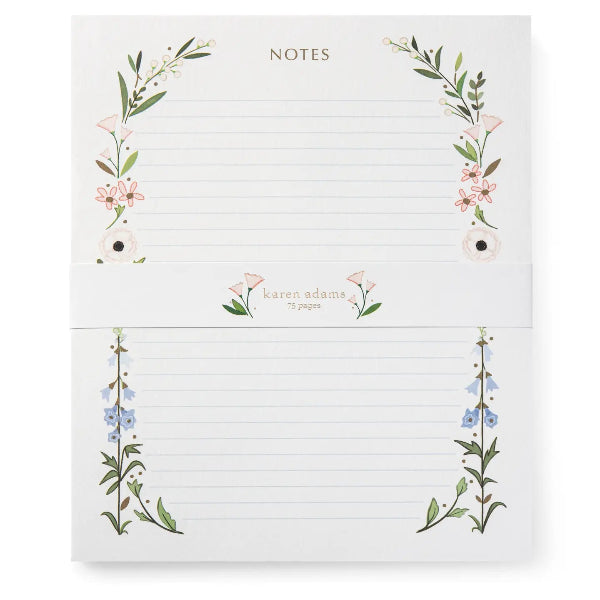 Notebook with floral designs on a white background