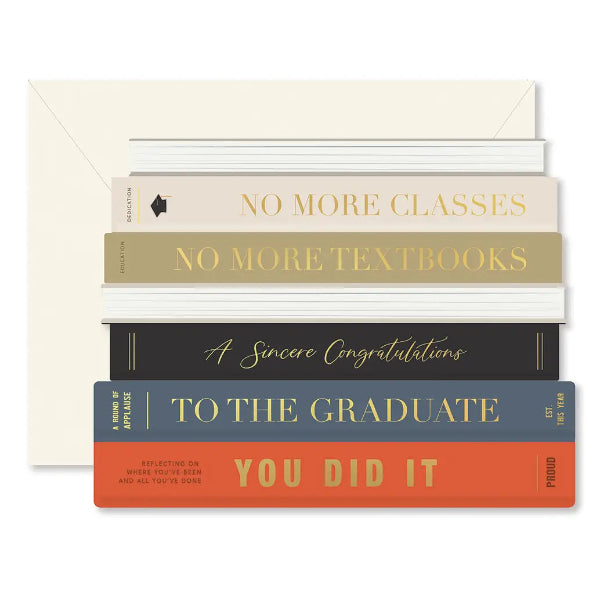 Stack of books with graduation-themed text on a white background