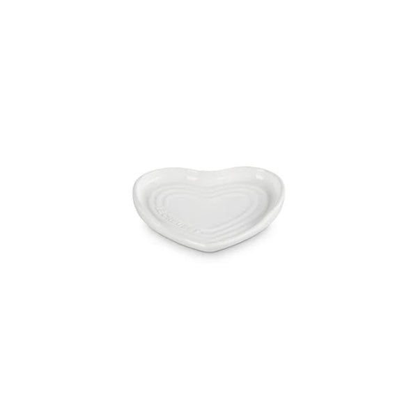 White heart-shaped ceramic dish on a white background