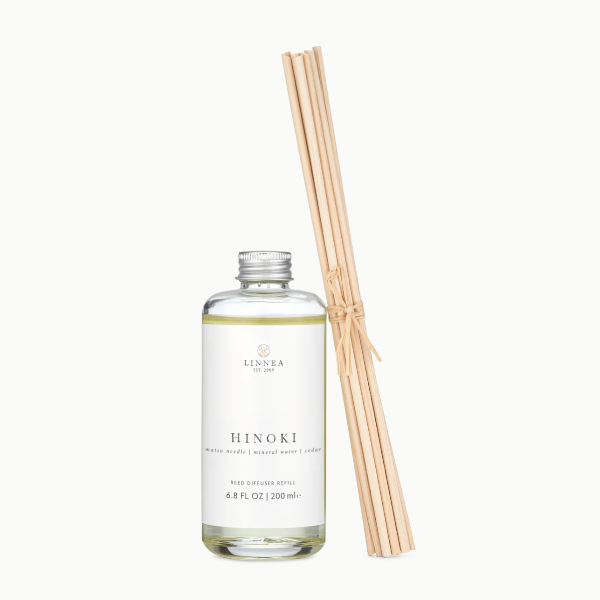 Linnea Hinoki diffuser bottle with reeds on a white background
