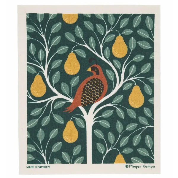 A swedish dishcloth featuring a stylized bird perched on a tree with white branches, green leaves, and yellow pears on a dark green background. The print has a white border with small text reading 'MADE IN SWEDEN' and 'Megan Kampa' at the bottom.